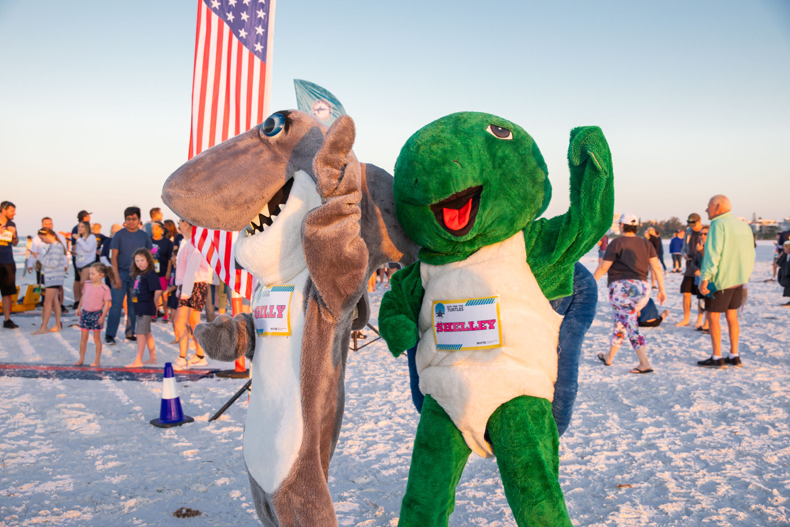 Mote mascots Gilly the Shark and Shelley the Sea Turtle at Mote's Run for the Turtles finish line